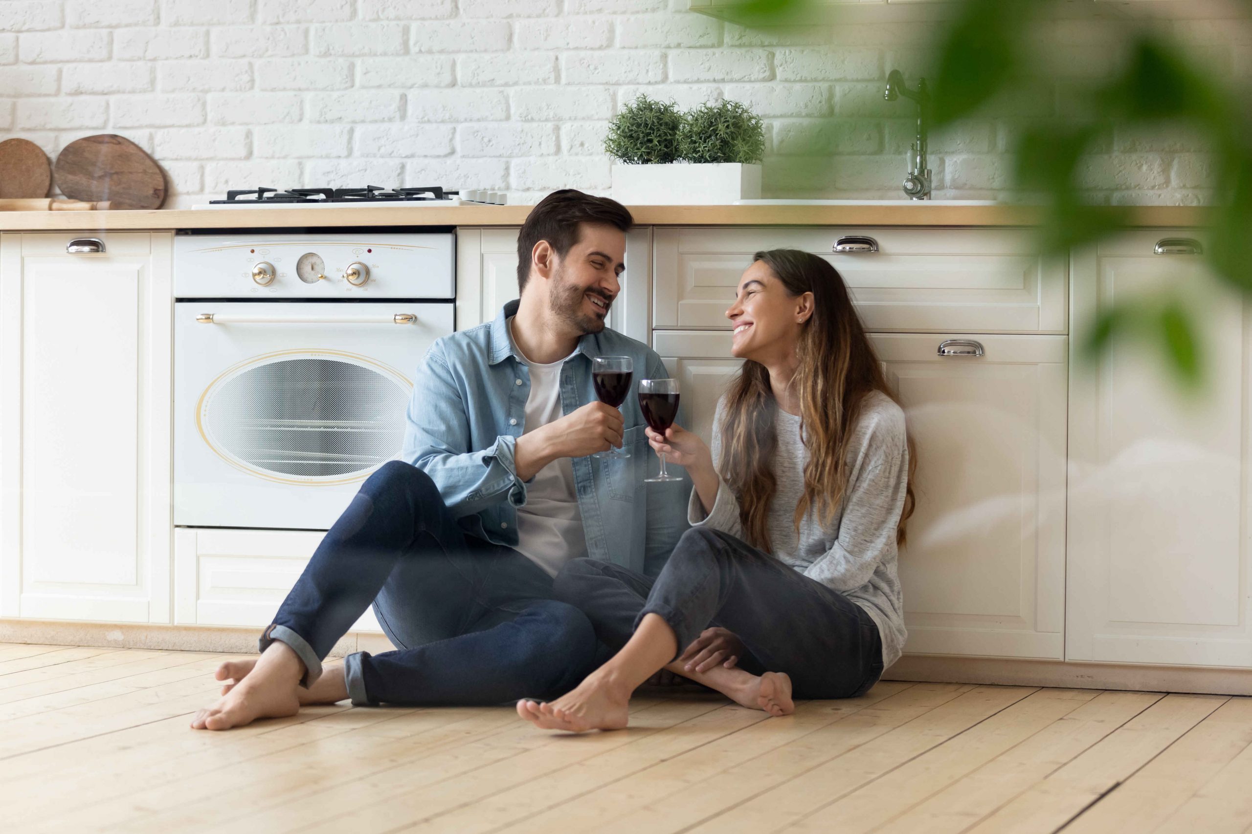 happy couple having red wine