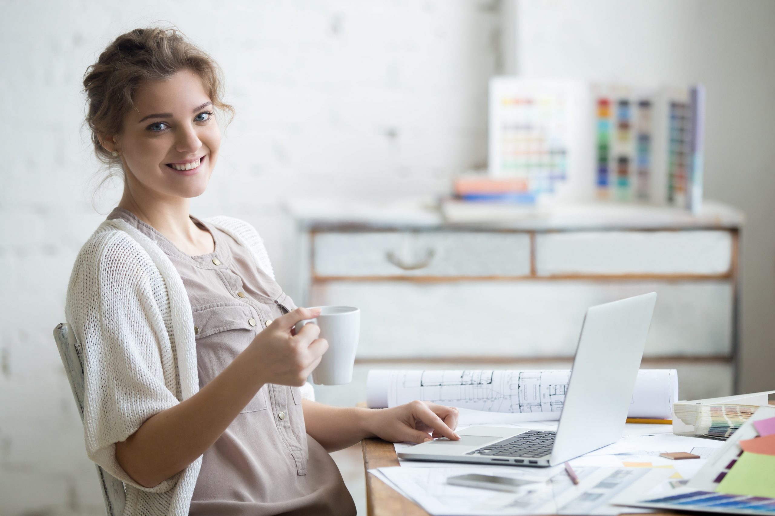 woman smiling while working