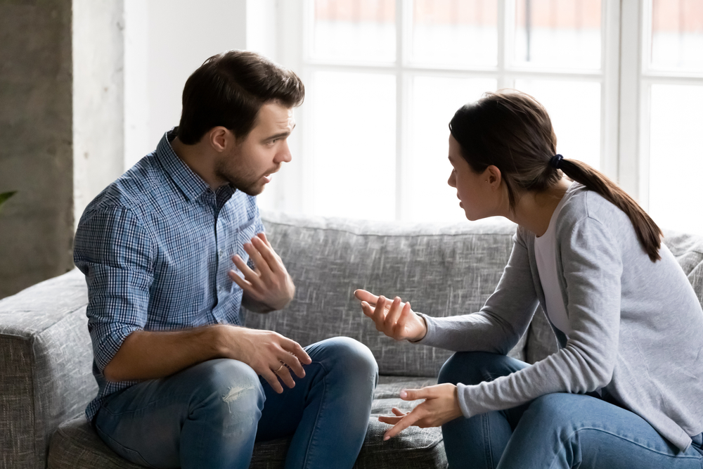 couple on a couch having an argument