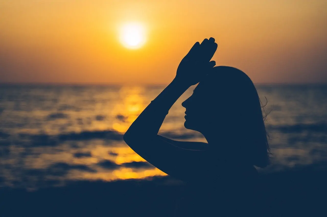 Spiritual Woman Holding Her Hands Up in Prayer