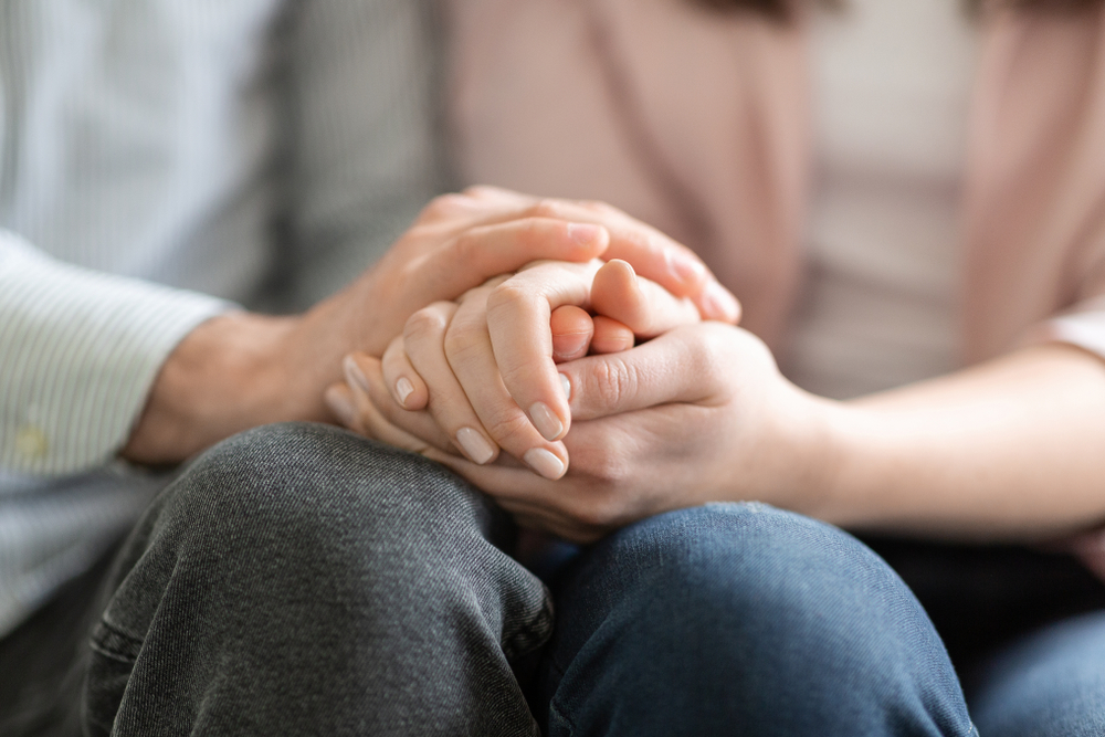 man and woman holding hands