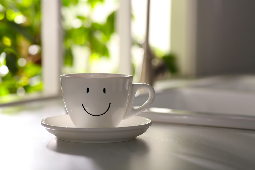teacup with happy face