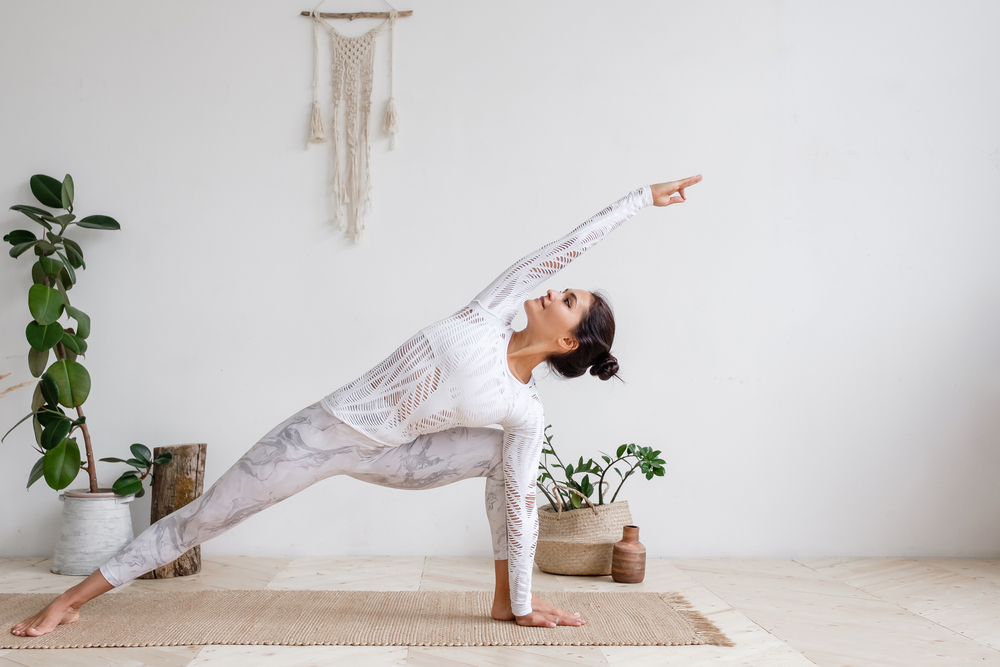 woman practising yoga at home