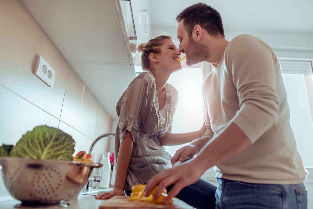 couple cooking healthy food together