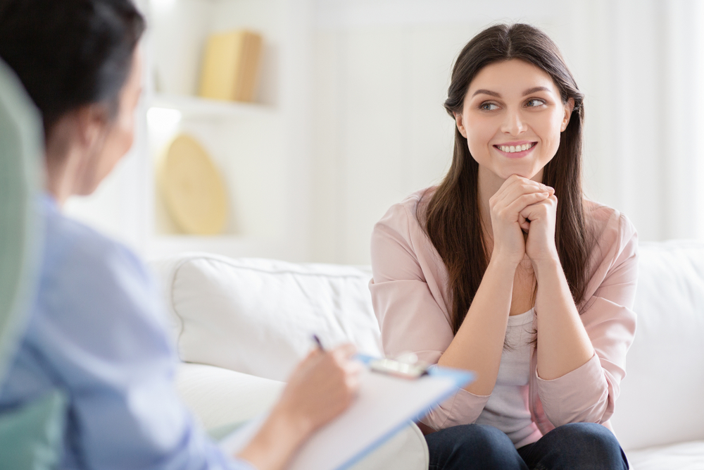 smiling woman talking to a life coach