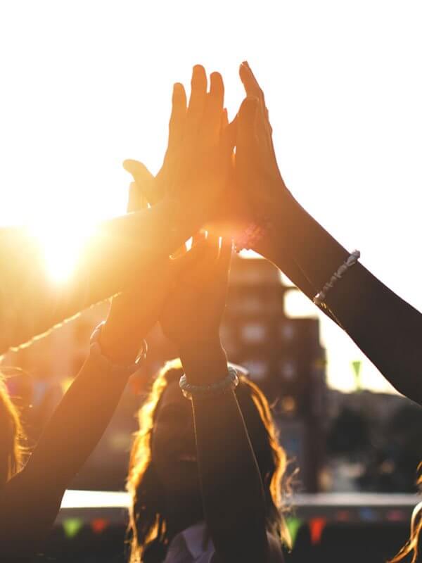 group of people doing a high five