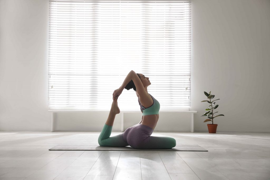 woman-practising-yoga-at-home