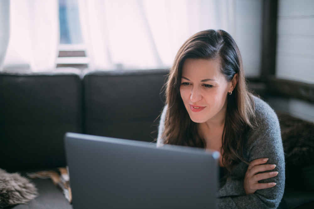 woman talking to someone on video call on laptop