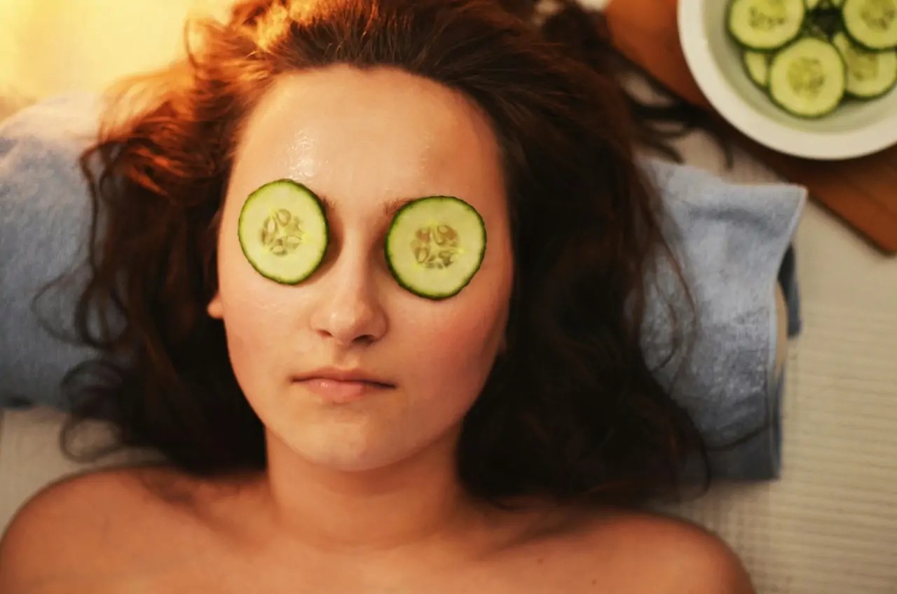 Woman with Cucumbers on Her Eyes Practicing Self Care at a Spa