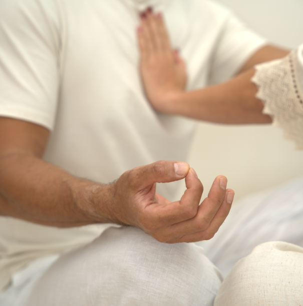 Person practicing breathwork and meditation to support stress relief, nervous system regulation, and holistic wellbeing.