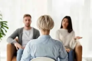 couple sitting in front of relationship coach