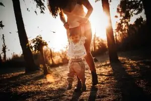 M1 B2 Mother Lifting Up Boy